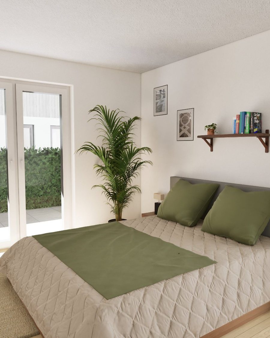 Schlafzimmer mit Doppelbett und bodentiefem Fenster, das direkt in den Garten führt
